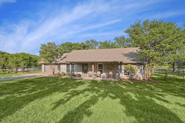 back of house with a lawn