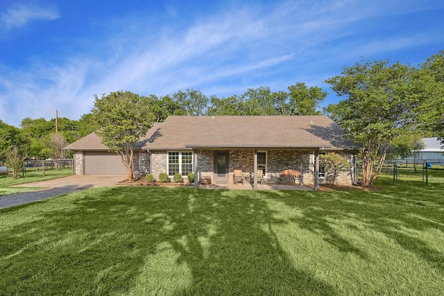 view of front of house with a garage and a front yard