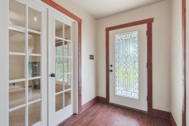 entrance foyer with dark wood-type flooring and french doors