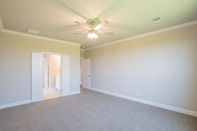 unfurnished room with ornamental molding, ceiling fan, and carpet floors