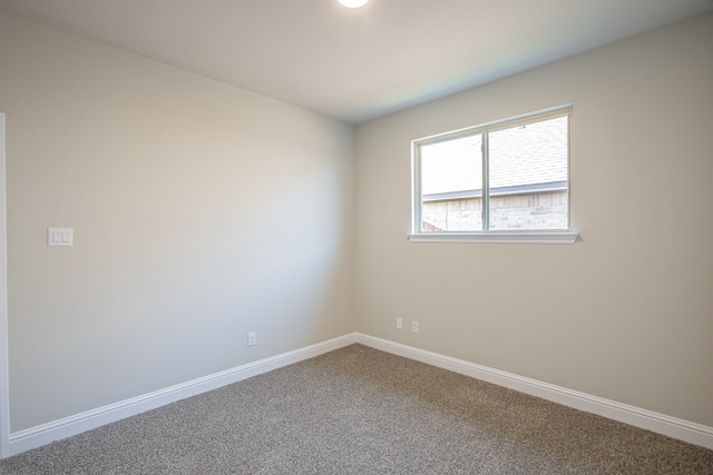 unfurnished room featuring carpet floors