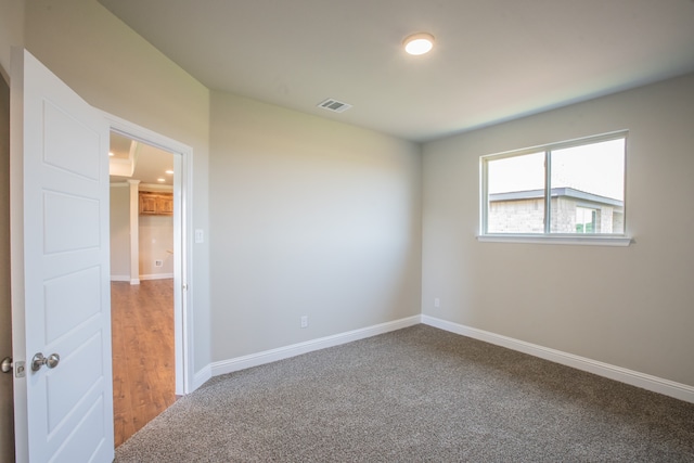 spare room with carpet floors