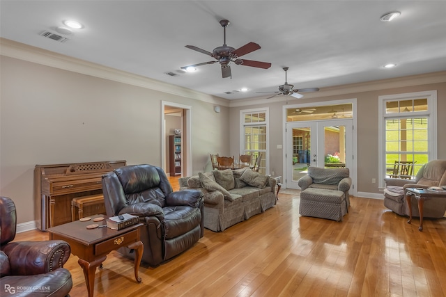 living room featuring ornamental molding, french doors, ceiling fan, and light hardwood / wood-style flooring