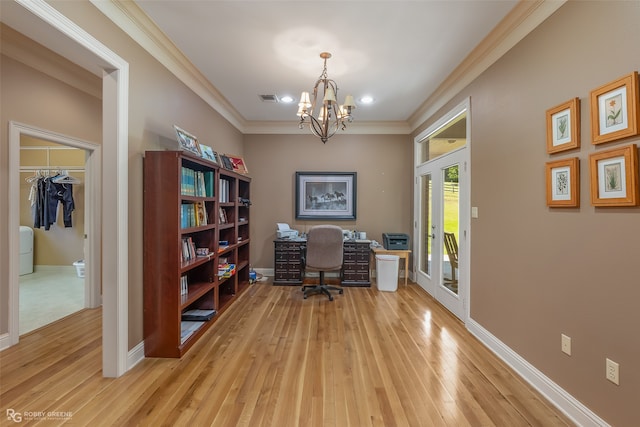 office featuring french doors, light hardwood / wood-style floors, a chandelier, and ornamental molding