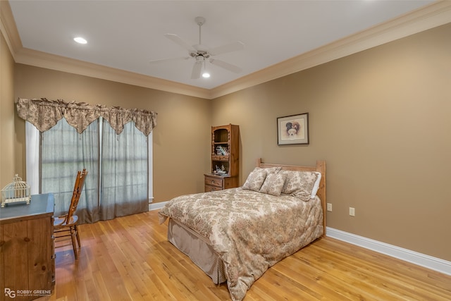 bedroom with ornamental molding, light hardwood / wood-style floors, and ceiling fan