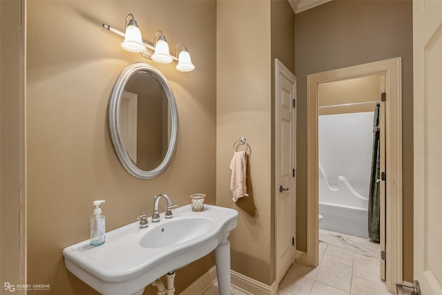 bathroom featuring sink, shower / bath combo, and tile floors