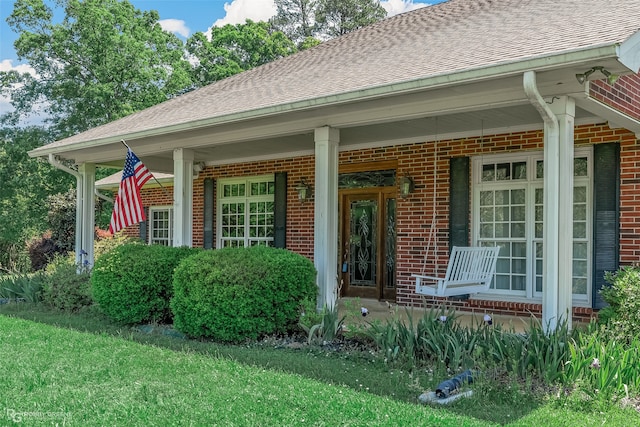 view of front of home featuring a porch and a front yard