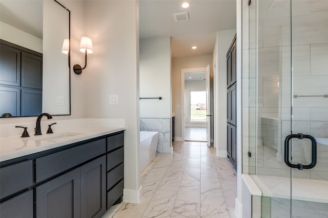 bathroom with tile patterned flooring, shower with separate bathtub, and vanity