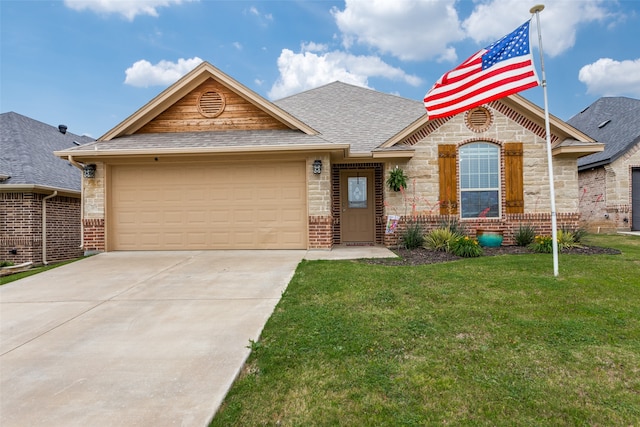 view of front of home with a front yard and a garage