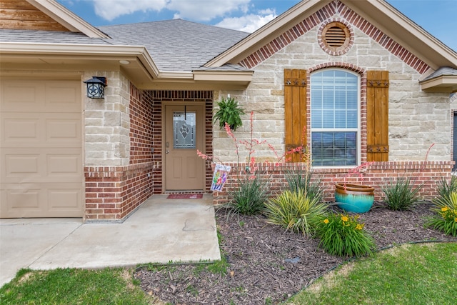 view of exterior entry featuring a garage