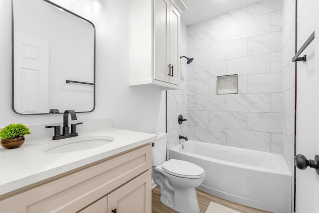bathroom with wood finished floors, toilet, shower / tub combination, and vanity