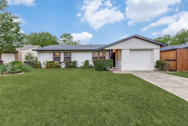 ranch-style house with a front lawn and a garage