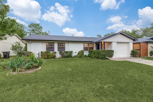 ranch-style house with a front yard and a garage