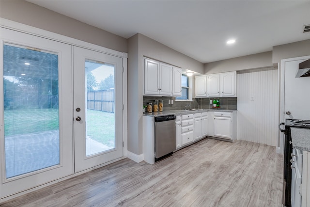 kitchen with plenty of natural light, light wood-type flooring, dishwasher, and white cabinetry