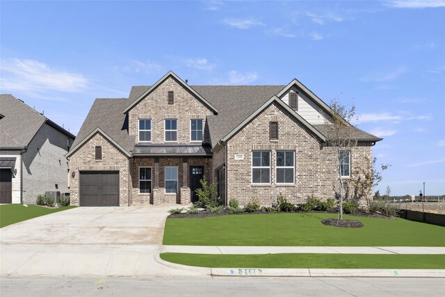 view of front of home featuring central AC and a front lawn