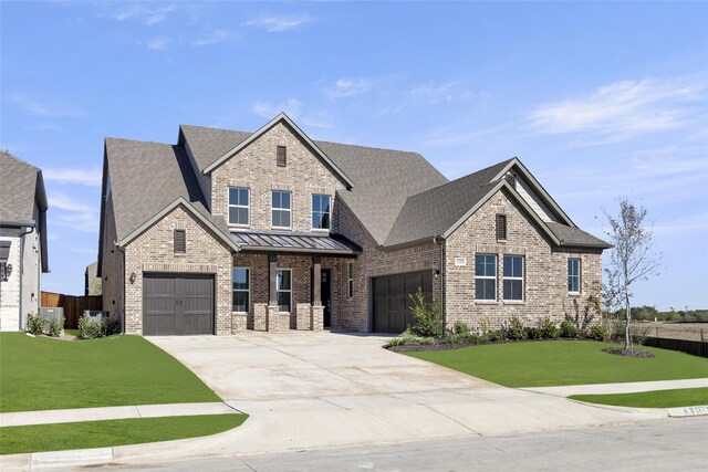 view of front facade featuring a garage and a front yard