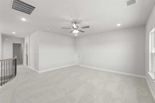 carpeted empty room featuring ceiling fan