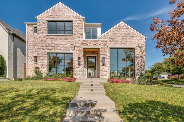 view of front of property with a front lawn