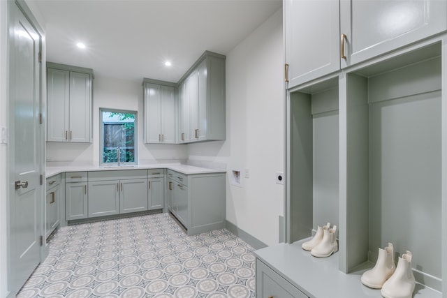 laundry area with sink and cabinets