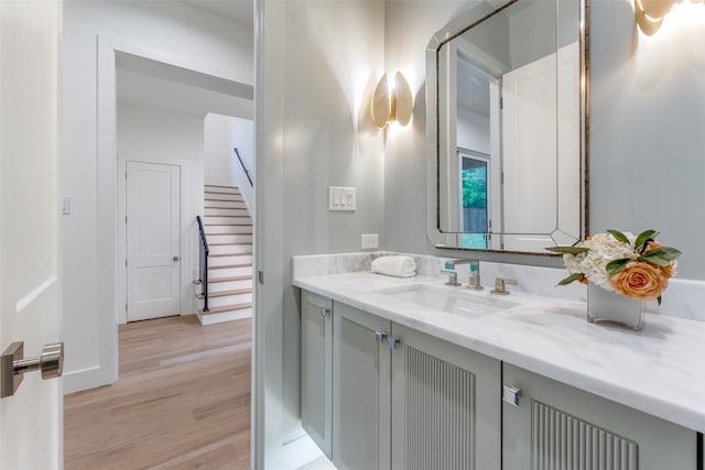 bathroom with vanity and wood-type flooring