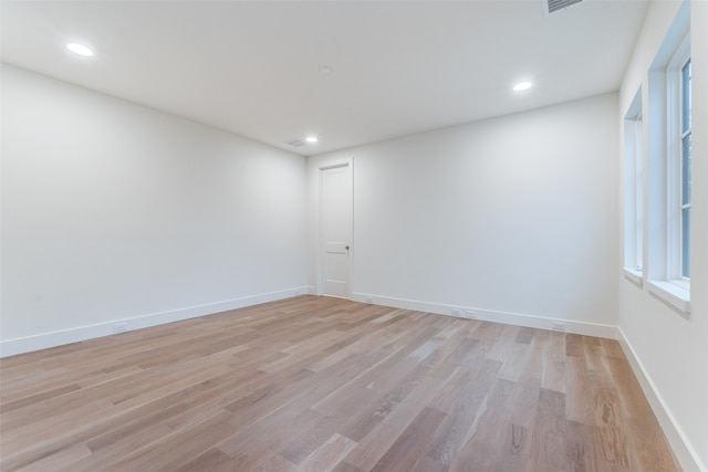 unfurnished room with light wood-type flooring