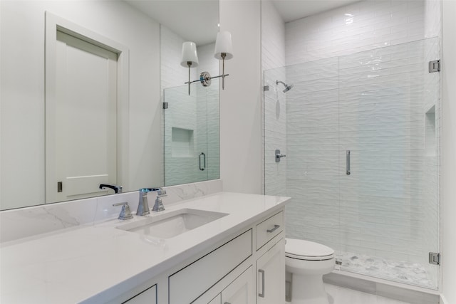 bathroom with walk in shower, vanity, and toilet