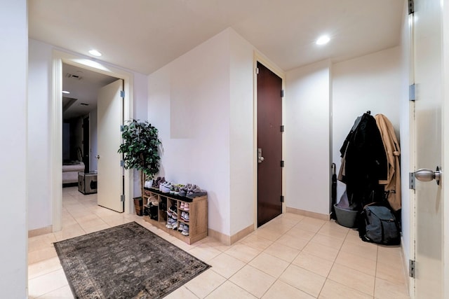 interior space featuring light tile flooring