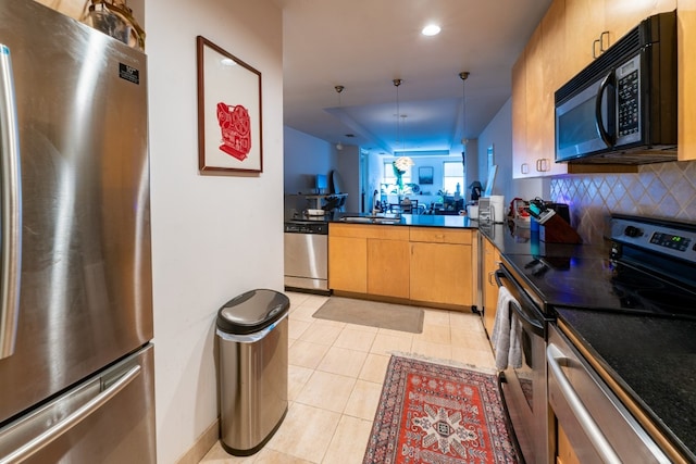 kitchen featuring hanging light fixtures, light tile flooring, backsplash, stainless steel appliances, and sink