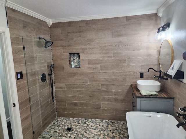 bathroom featuring vanity, ornamental molding, and tiled shower