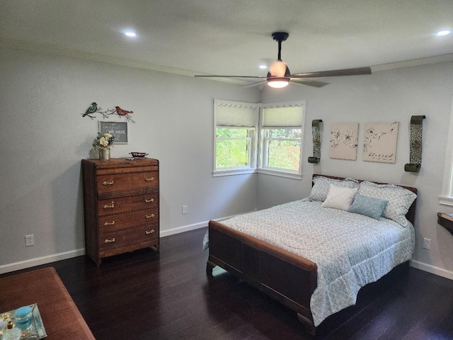 bedroom featuring dark hardwood / wood-style flooring, crown molding, and ceiling fan