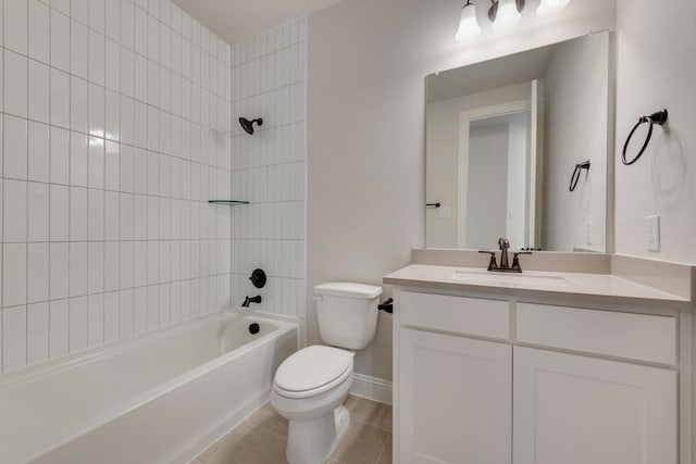 bathroom featuring tile patterned floors, toilet, shower / washtub combination, baseboards, and vanity