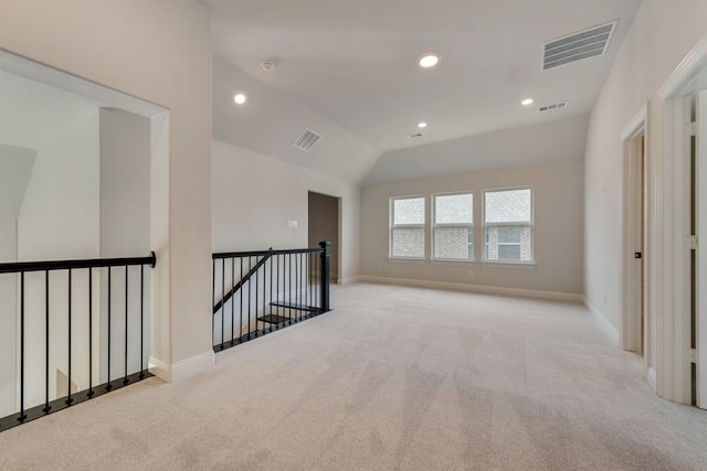 unfurnished room featuring baseboards, visible vents, and carpet floors