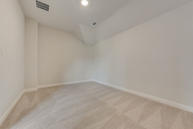 unfurnished room featuring light carpet, visible vents, and baseboards