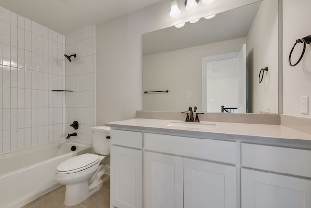 bathroom with tile patterned flooring, toilet, vanity, and bathtub / shower combination