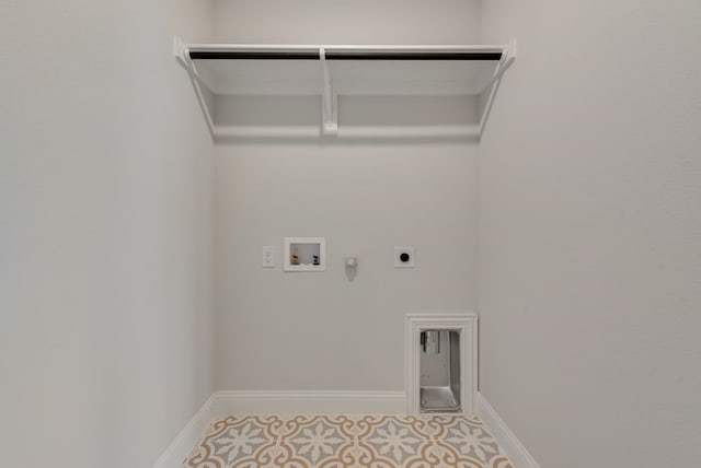 laundry area featuring gas dryer hookup, baseboards, hookup for an electric dryer, hookup for a washing machine, and laundry area