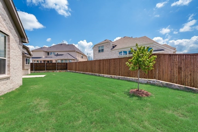 view of yard featuring a fenced backyard