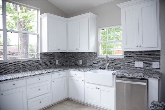 kitchen with dishwasher, tasteful backsplash, white cabinetry, and light stone countertops