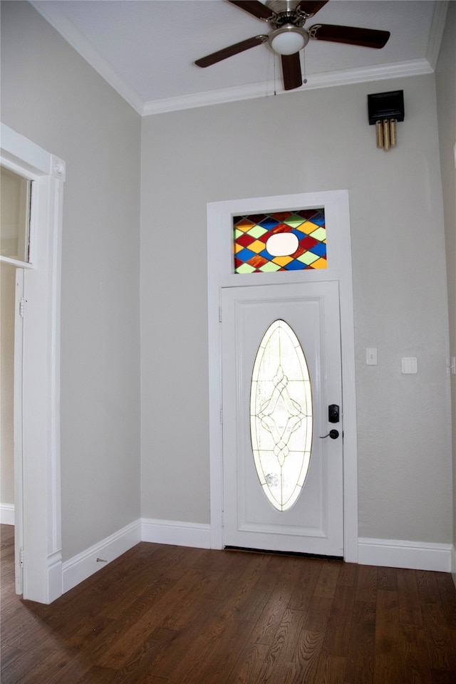 foyer with dark hardwood / wood-style floors, ceiling fan, and ornamental molding