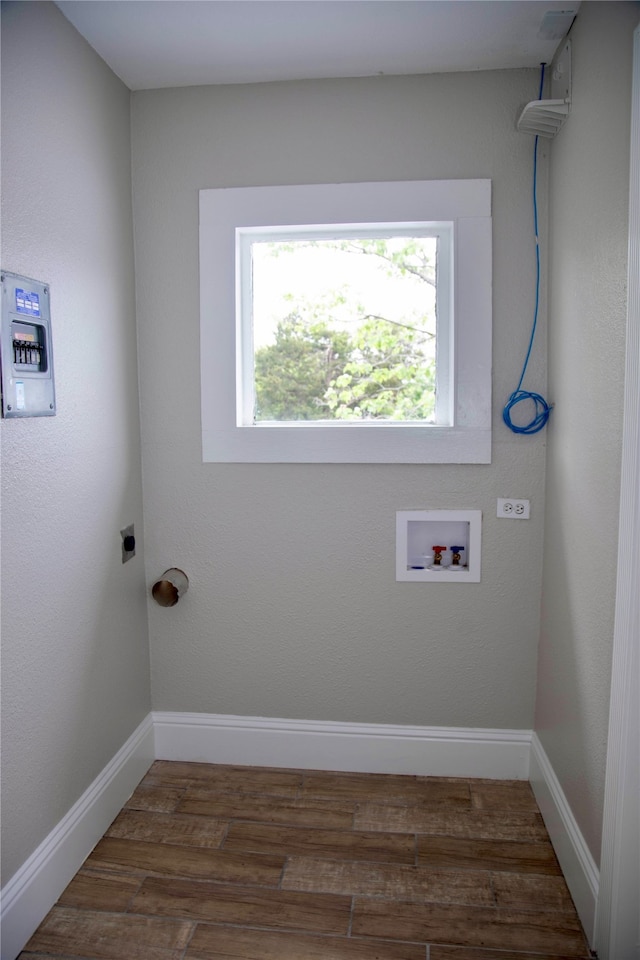 laundry room featuring hookup for a washing machine, electric dryer hookup, and hardwood / wood-style floors