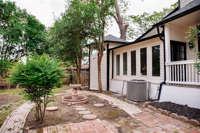 view of yard with central air condition unit