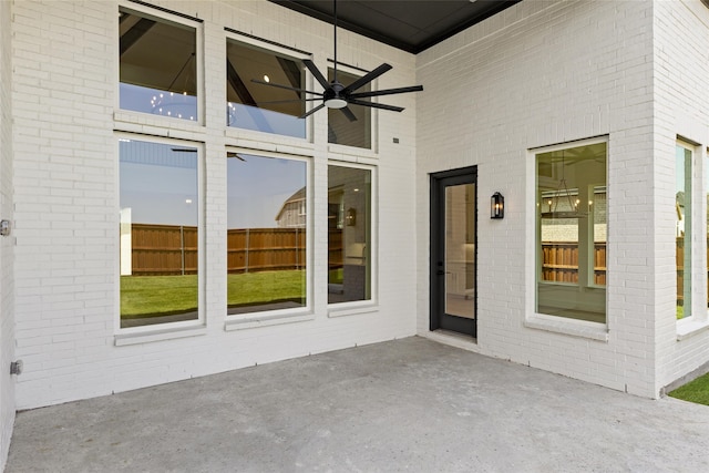 property entrance with ceiling fan and a patio