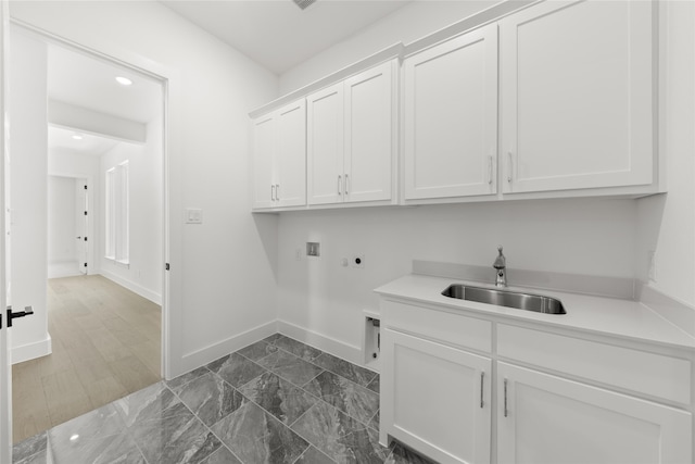 laundry room featuring hookup for an electric dryer, cabinets, sink, and washer hookup