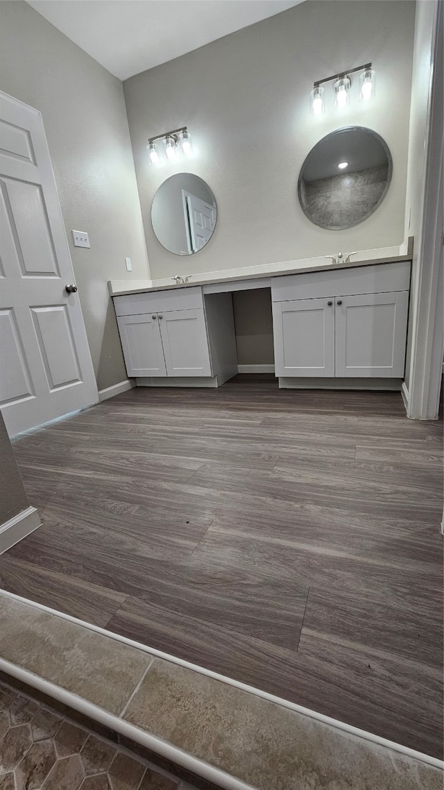 bathroom featuring hardwood / wood-style flooring and vanity