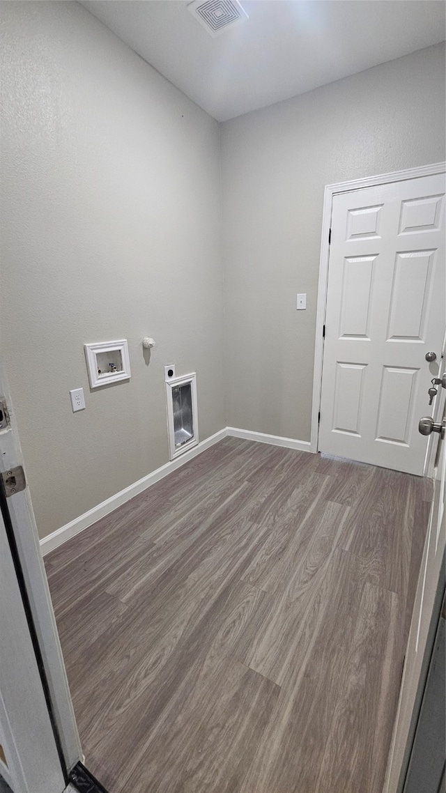 laundry room with hardwood / wood-style flooring, washer hookup, and hookup for an electric dryer