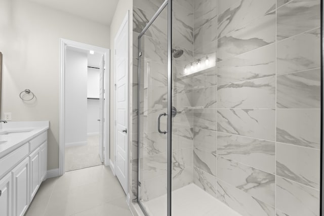 bathroom with vanity, an enclosed shower, and tile patterned flooring