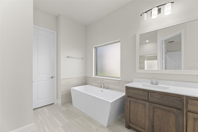 bathroom featuring a bathtub and vanity