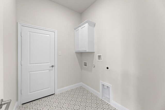 clothes washing area with hookup for an electric dryer, hookup for a washing machine, hookup for a gas dryer, and cabinets