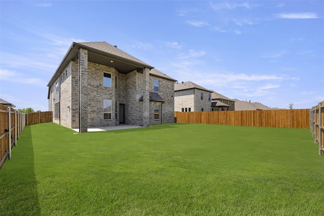 rear view of house with a lawn