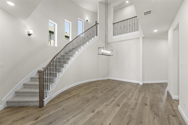 stairs featuring hardwood / wood-style floors