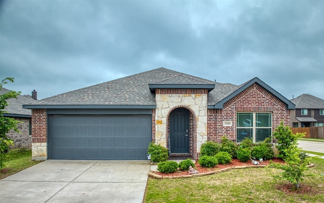 ranch-style home featuring a garage and a front lawn